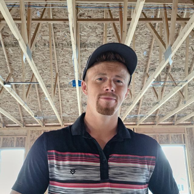 Philip Nielsen, owner of America 1st Construction, on a framed job site.